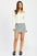 MINI SKIRT WITH DIAGONAL BUTTON DETAIL