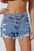 Crossover Cutie High Rise Distressed Denim Shorts